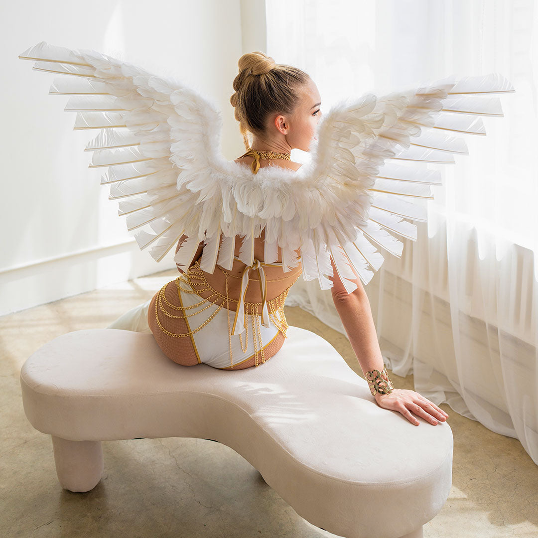 http://featherplace.com/cdn/shop/files/large-white-angel-wings-WG109--W-INUSE19.jpg?v=1697727045